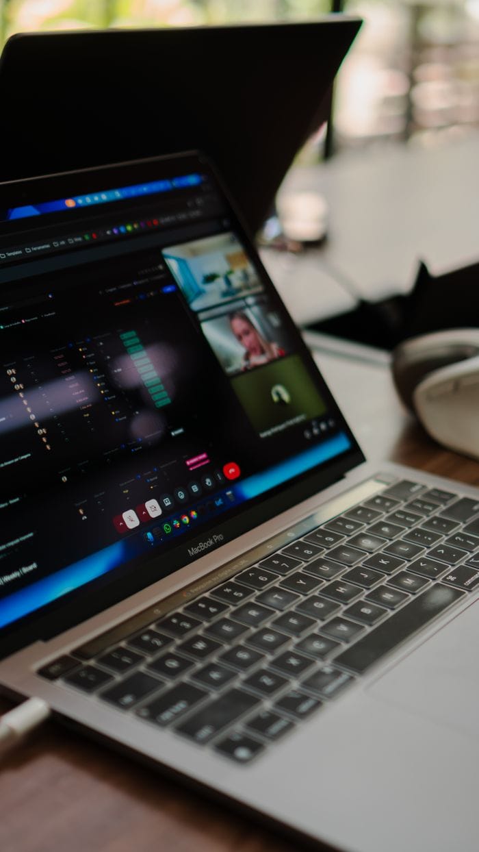 Services A laptop showing a video conference call, ideal for remote work concepts.